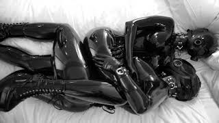 Black latex girls cuddling.