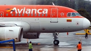 Airbus A318 being towed and taxiing