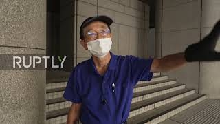 Japan: Homeless people set up encampments under Olympics banners outside govt building in Tokyo