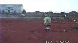 Fat kid on a moped crashes