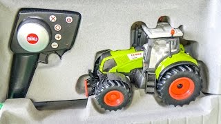 RC tractor gets unboxed and works hard for the first time!