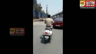 Police person without helmet on  main road near JNTU. Kukatpally cop is from KPHB Police station .