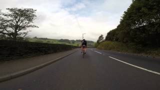 Road bike cycling descent into Holmfirth, Yorshire, UK 14/09/14