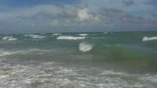 Naked couple walking on Miami Beach