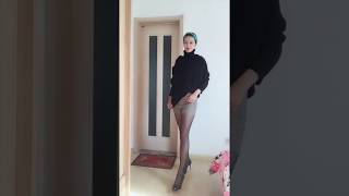 Temperament mature woman shows beautiful legs in black stockings