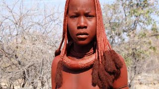 Namibian Himba tribe woman explaining a day in the life