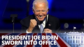 Biden’s inauguration takes place under tight security & pandemic