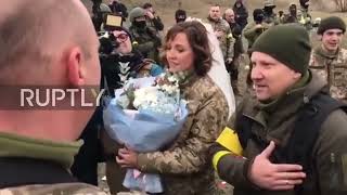 Ukraine: Territorial defence fighters marry near one of checkpoints in Kyiv