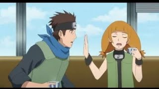 Moegi stops Konohamaru from talking about Naruto