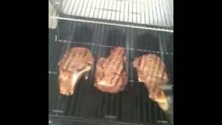 Char griller duo cooking steaks