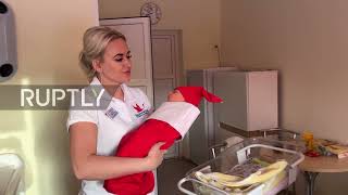 Russia: Maternity hospital delivers newborns to parents in festive outfits