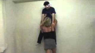 lift by waist against the wall