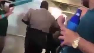 POLICE BRUTALITY BLACK OFFICERS KNOCK A YOUNG WHITE WOMAN OUT COLD AND ARREST HER