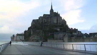 High tide brings onlookers to Mont-Saint-Michel landmark
