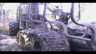 TDT- 55 tractor stuck in deep mud, Timberjack 1010D helps, extreme mud conditions