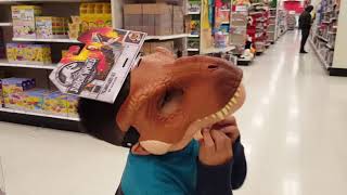 isaac trying jurassic world t rex mask dinosaur at target store