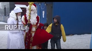 Belarus: Father Frost gives presents to refugees near Polish border