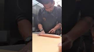 cutting yellowtail for sushi, tagliando riccola per sushi