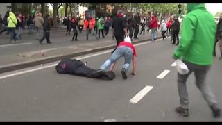 A police officer is knocked out by a protester Belgium