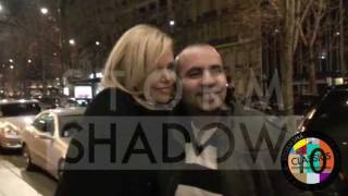 Charlize Theron offered flowers by a fan in paris
