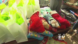 Southlake Moms Giving Stuffed Stockings To Children For Christmas