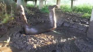 Tight leggings and boots in nice thick mud, plus headfirst dive