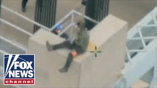 Shocking video: New York police save suicidal man on top of bridge