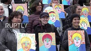 Germany: Berliners paint Merkel portraits in farewell tribute