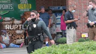 Families wait for updates after student killed in North Carolina high school shooting, manhunt u...