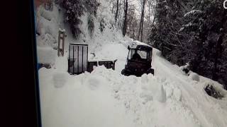 Plowing top driveway with Argo 8x8 with tracks