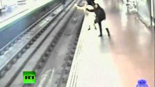 CCTV Drama: Man falls on rails, pulled out in front of moving train