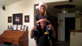 Dad giving "little" sister a lift on his shoulders