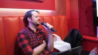 George sings "Snake Eater" at a Karaoke parlor in Tokyo