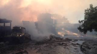 Bulldozer working on burning hay at the Frizelle Enos fire in Sebastopol