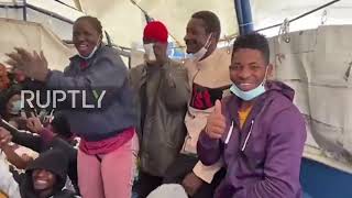 Italy: Migrants celebrate after vessel with 176 onboard gets permission to dock in Lampedusa