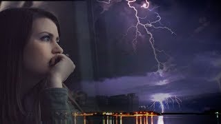 Футаж. Девушка смотрит на грозу