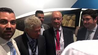 Swig leader talking with D.r Anatoly unitskiy regarding Skyway in exhibition