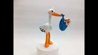 обзор фигурки  Аист с ребёнком