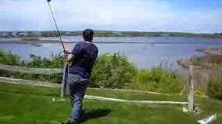 Gil Driving a Golf Ball over the Peninsula