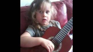Talitha B plays the guitar
