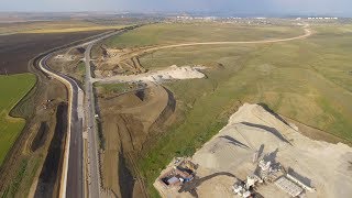 Крымскій мостъ 4К: Строительство автоподходовъ, развязка съ трассой «Таврида»