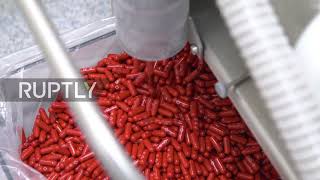 Netherlands: Merck's COVID-19 pill seen packed for shipment as US FDA authorises it for home use