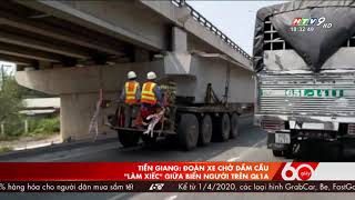 Đoàn xe chở dầm cầu "làm xiếc" giữa biển người trên QL1A.  Cre: 60 giây, 18h30 ngày 19/01/2020