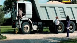 woman steps on clutch in sandals