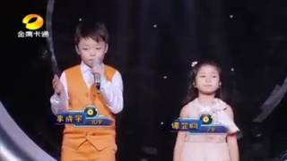 Two young kids singing gospel song (you raise me up)
