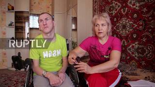 Russian mother carries wheelchair-bound son up and down stairs for 18 years
