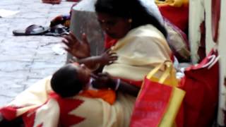 Mother Sitting With Her Child In Her Lap