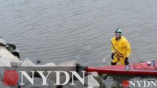 Swimmer Christopher Swain swims the Gowanus Canal on Earth Day