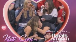 Woman Stuffs Her Face With Pizza During Couple's Kiss Cam
