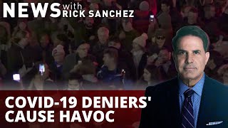 Watch maskless protesters call COVID-19 a hoax
